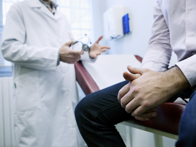 Male patient speaks with doctor